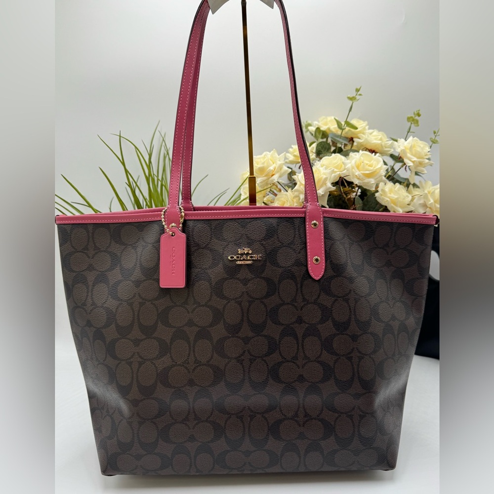 Coach Reversible City Tote in the signature brown canvas with a pink interior